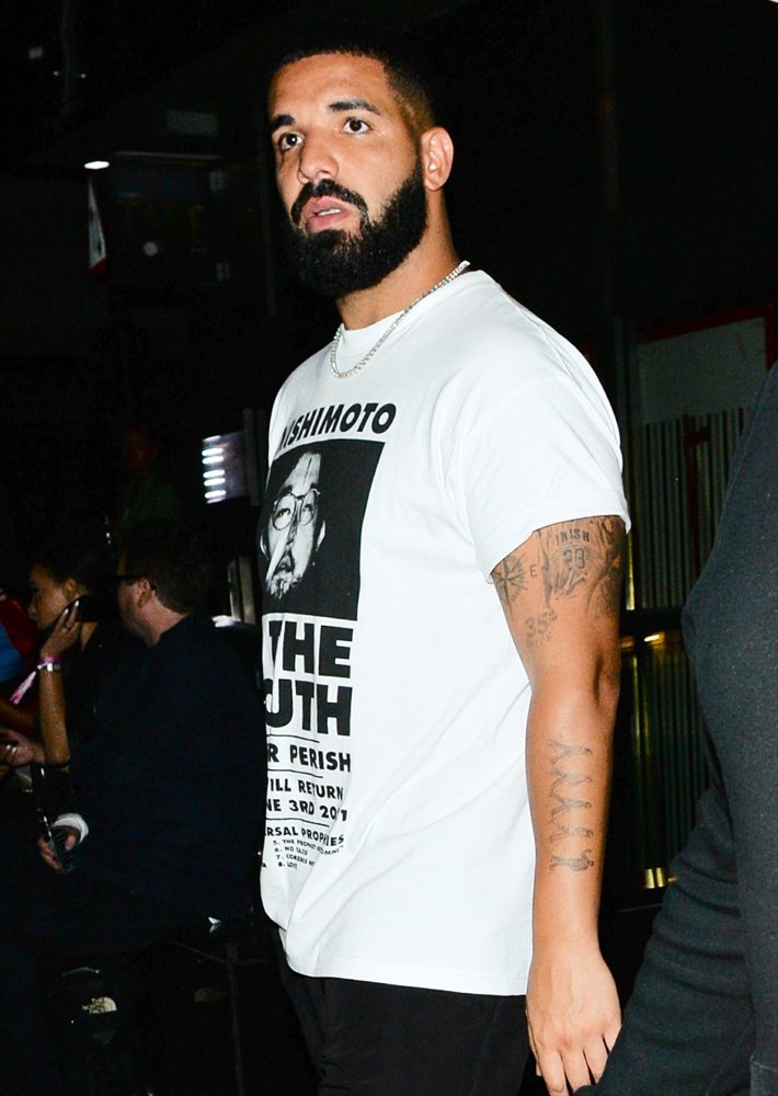 Drake Seen Leaving Playboy Club