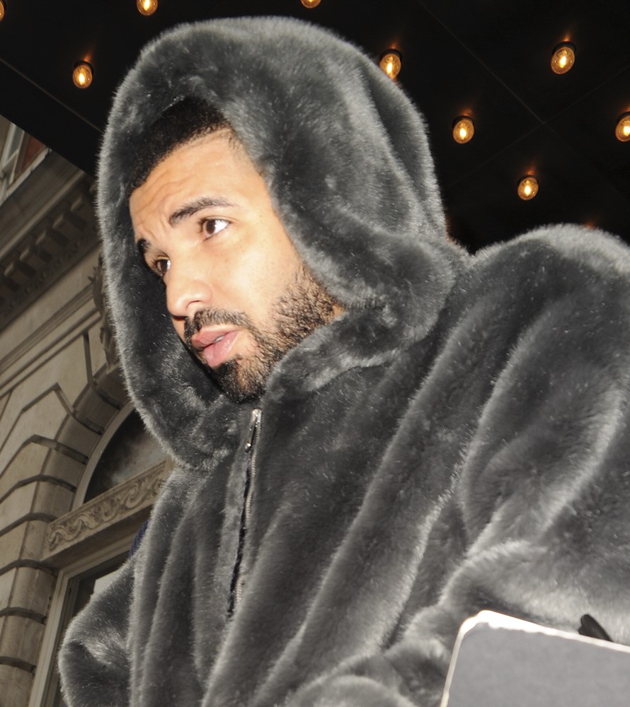 Drake Seen Leaving Rihanna's Hotel