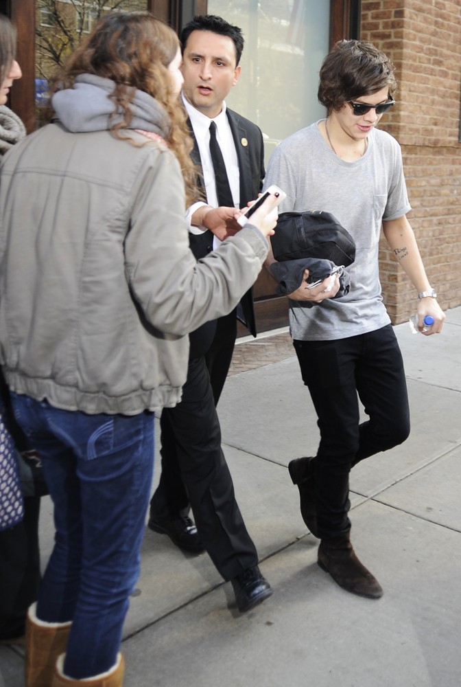 Harry Styles;One Direction;<br>Harry Styles Carrying A Toiletry Bag, Is Seen Leaving The Hotel That He and Taylor Swift Arrived