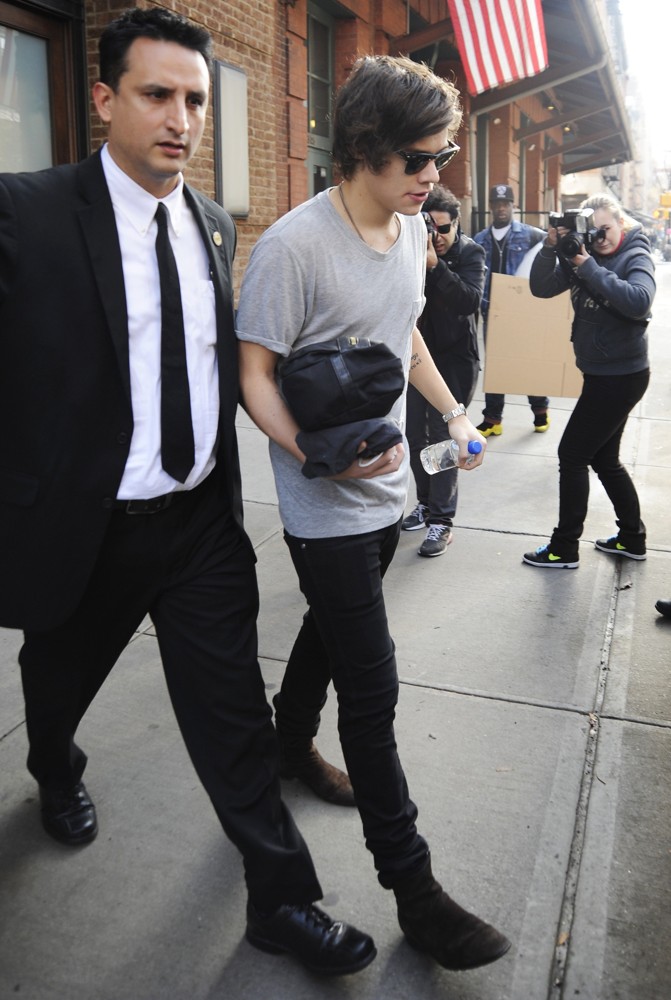 Harry Styles;One Direction;<br>Harry Styles Carrying A Toiletry Bag, Is Seen Leaving The Hotel That He and Taylor Swift Arrived