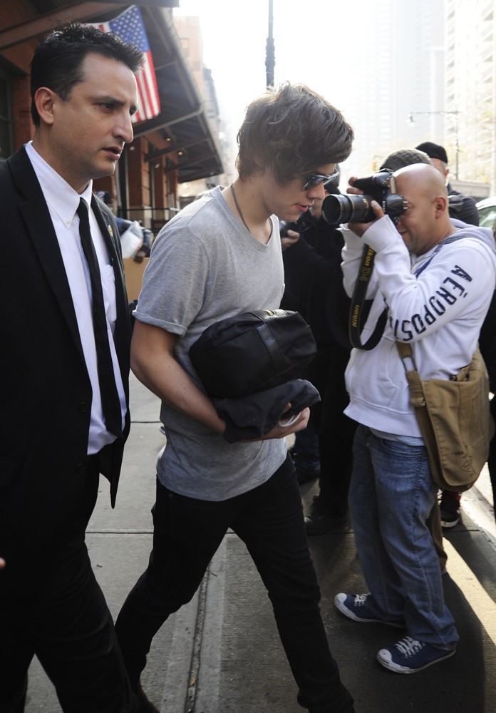 Harry Styles;One Direction;<br>Harry Styles Carrying A Toiletry Bag, Is Seen Leaving The Hotel That He and Taylor Swift Arrived