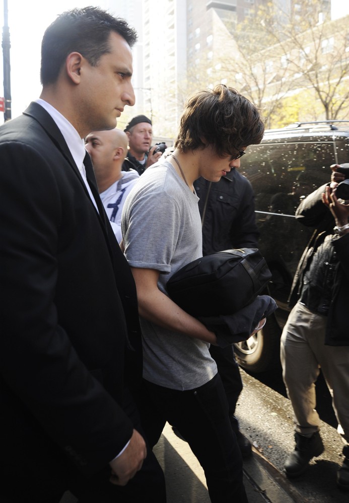 Harry Styles;One Direction;<br>Harry Styles Carrying A Toiletry Bag, Is Seen Leaving The Hotel That He and Taylor Swift Arrived