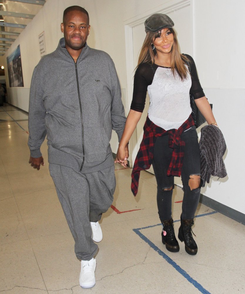 Tamar Braxton Arrives at Los Angeles International Airport with Vincent Herbert