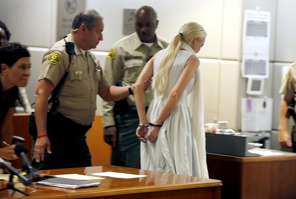 Shawn Chapman Holley;Lindsay Lohan;<br>Lindsay Lohan Being Escorted from The Courtroom in Handcuffs After A Judge Revoked