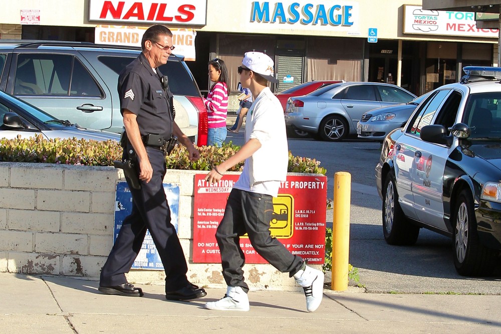 Justin Bieber;<br>Justin Bieber Is Asked by A Los Angeles Police Officer to Move His Fisker Karma