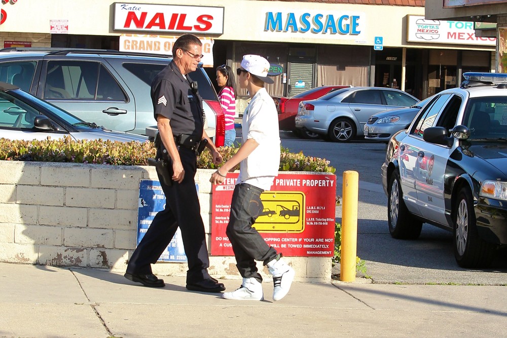 Justin Bieber;<br>Justin Bieber Is Asked by A Los Angeles Police Officer to Move His Fisker Karma