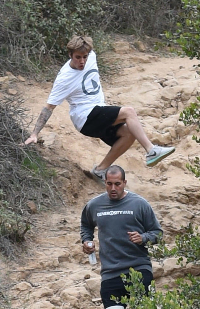 Justin Bieber Slips on A Steep Trail and Gets Right Back Up