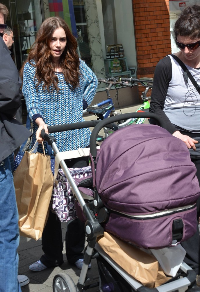 Photos: Lily Collins Drags Rack of Clothes Through the Street of Dublin ...