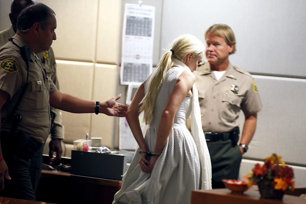 Lindsay Lohan;<br>Lindsay Lohan Being Escorted from The Courtroom in Handcuffs After A Judge Revoked