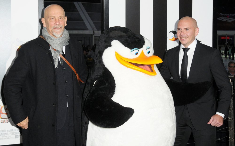 John Malkovich;Pitbull;<br>New York Premiere of Penguins of Madagascar