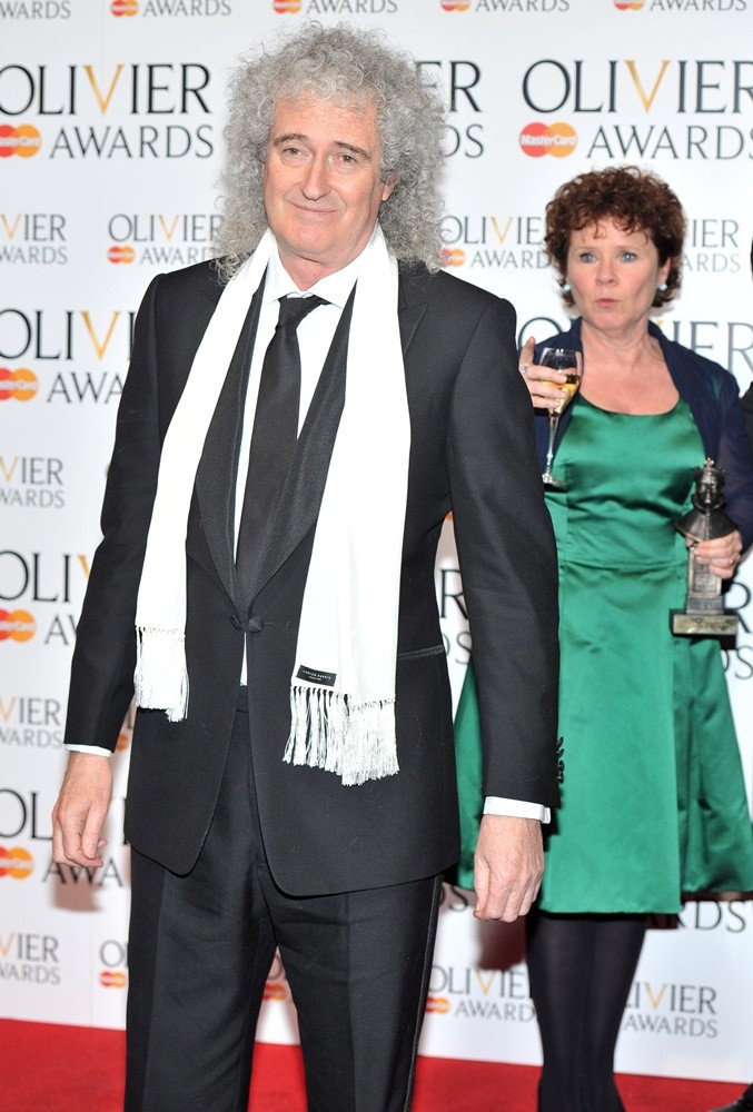 Brian May;Imelda Staunton;<br>The Olivier Awards 2013 - Press Room