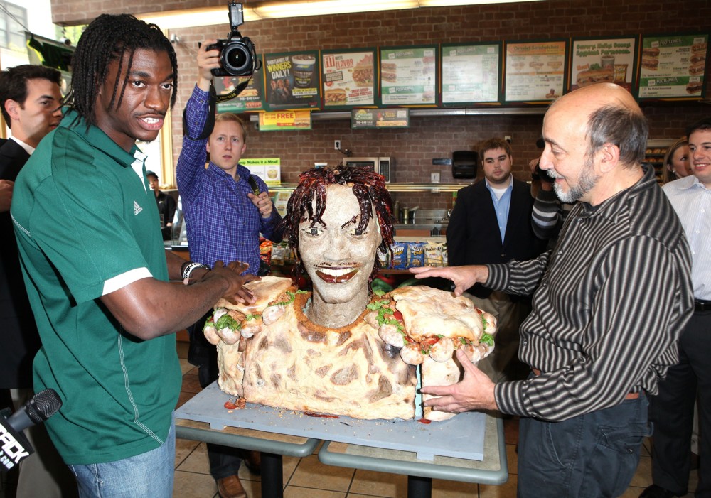 Robert Griffin III;<br>Unveils A New Lifesize Smokehouse BBQ Chicken