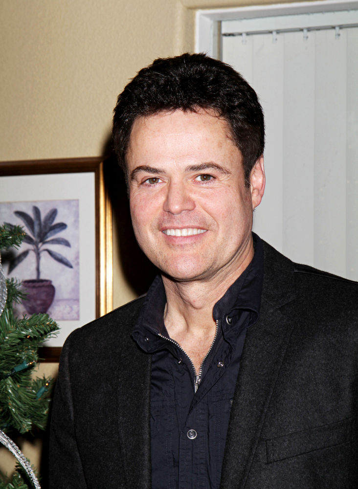 Donny Osmond;<br>Donny and Marie Osmond deliver food to senior citizens