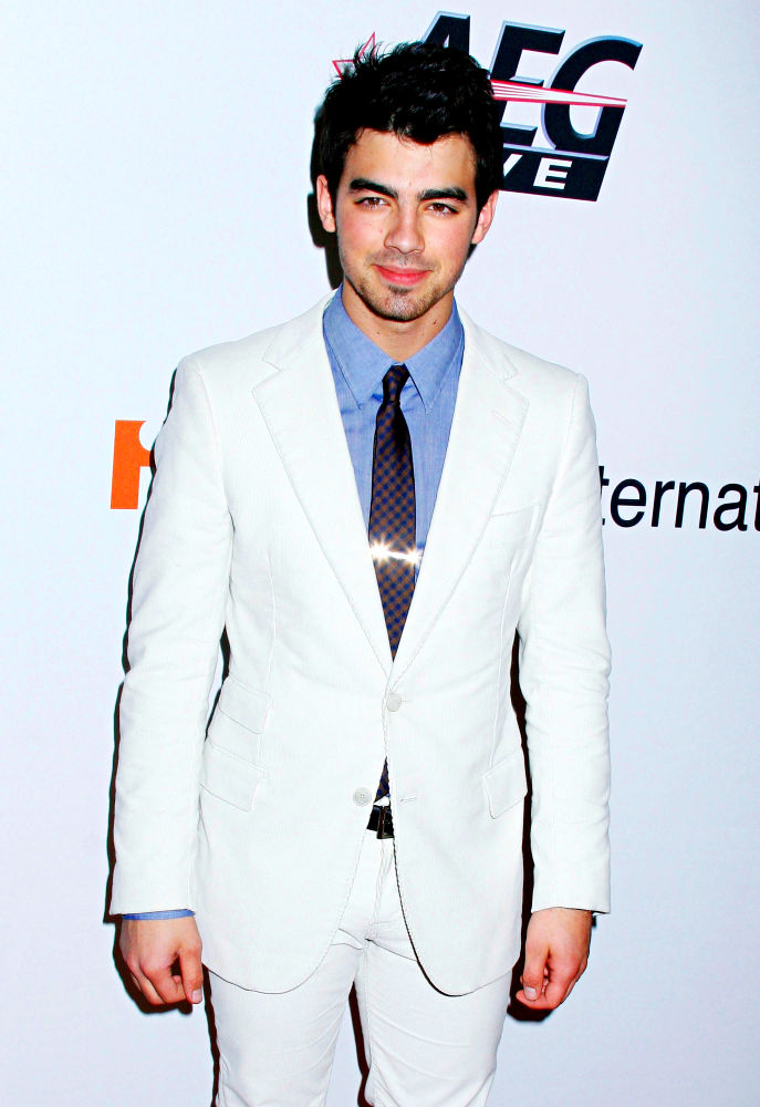 Joe Jonas;Jonas Brothers;<br>2010 Annual Clive Davis Pre-Grammy Party - arrivals