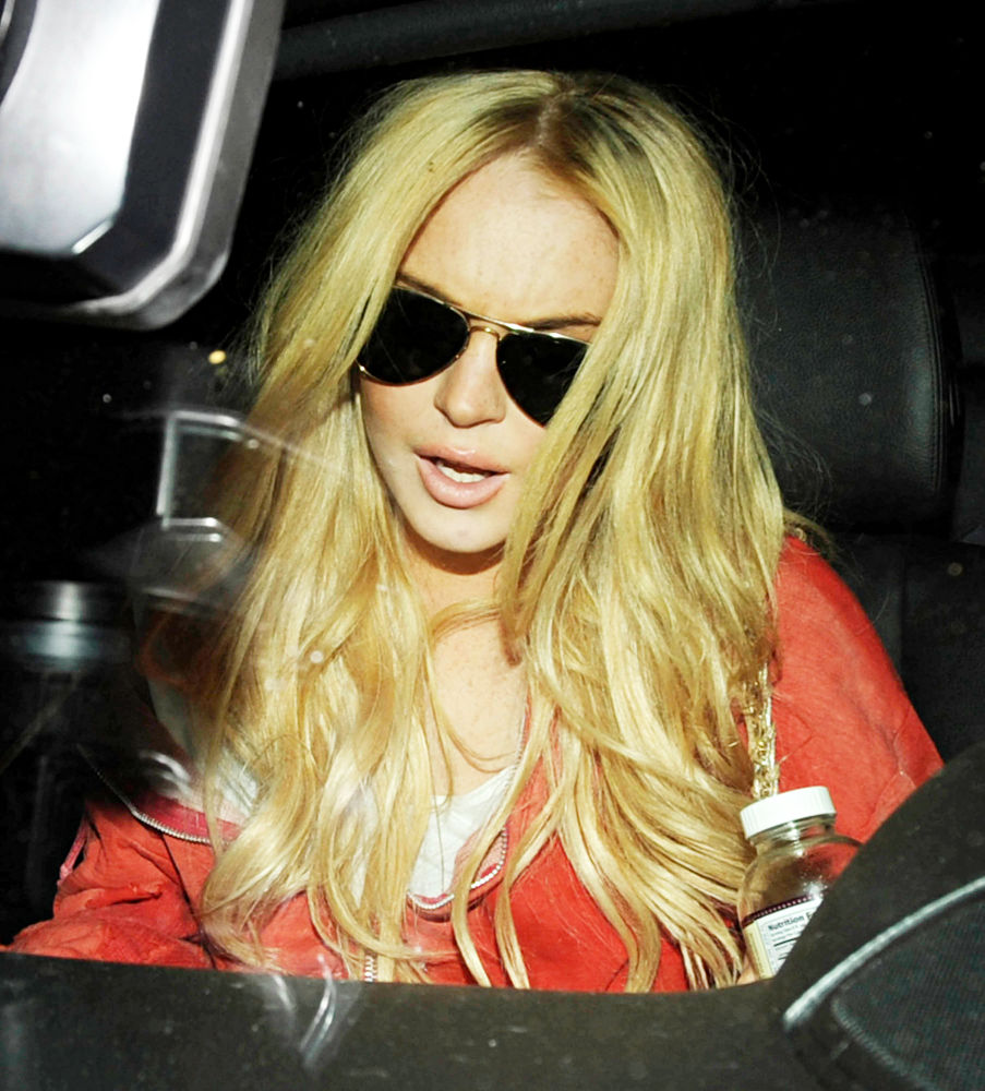 Lindsay Lohan in Lindsay Lohan sporting newly-dyed blonde hair as she lea.....