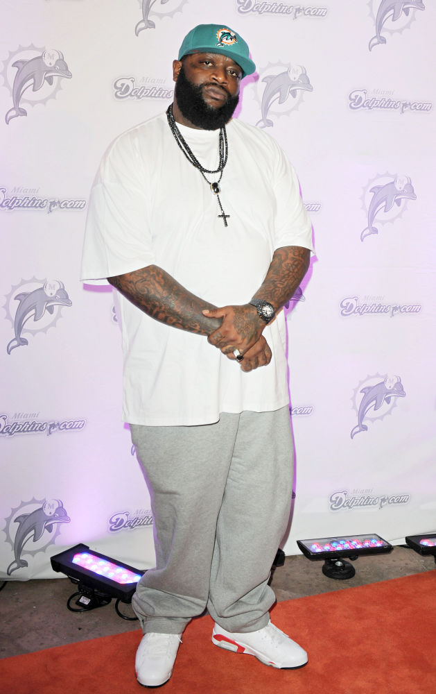 Rick Ross;<br>Rick Ross Arrives on The Orange Carpet Prior to The Miami Dolphins vs New England Patriots NFL Game
