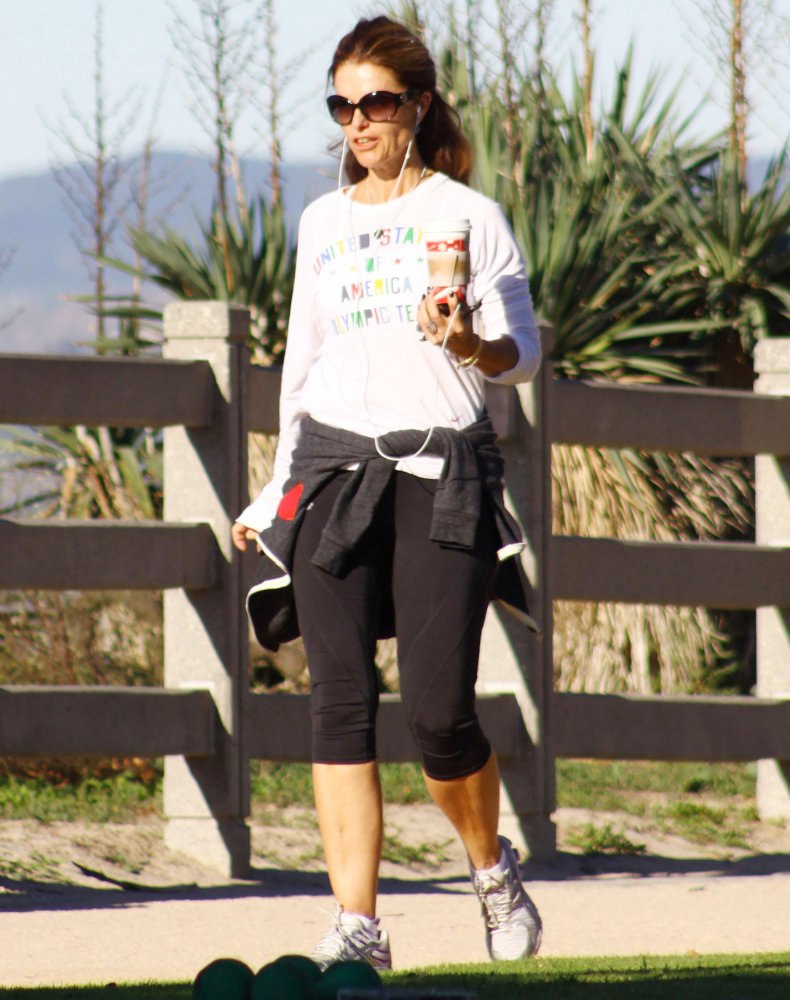 Maria Shriver;<br>Maria Shriver Carrying A Cup of Coffee While Out Jogging at The Park in Santa Monica