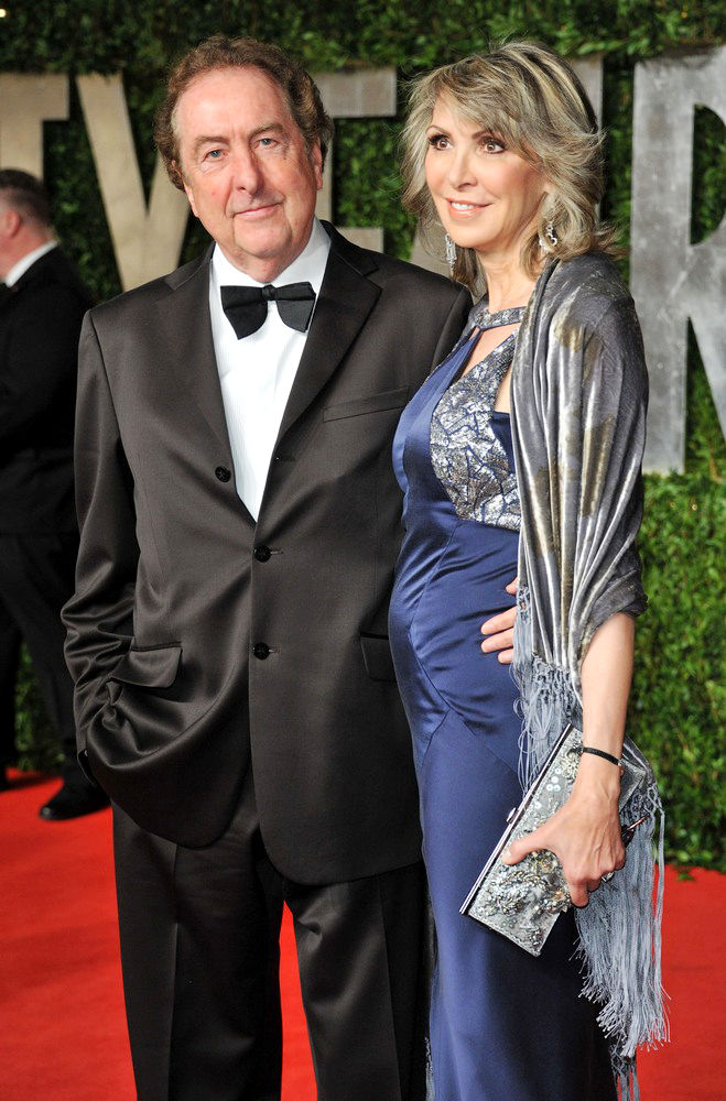 Eric Idle;Tania Kosevich;<br>2011 Vanity Fair Oscar Party - Arrivals