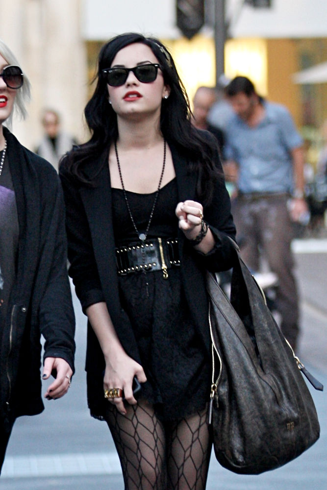 Demi Lovato;<br>Demi Lovato wearing an all black ensemble and carrying a large handbag, shopping in Hollywood