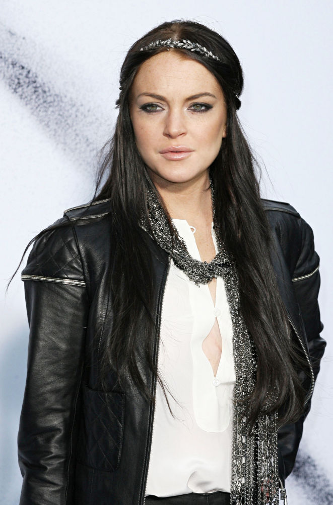 L.A. Paparazzi Force Lindsay Lohan to Spend Night at Home